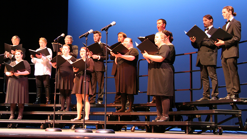 Music students singing on stage