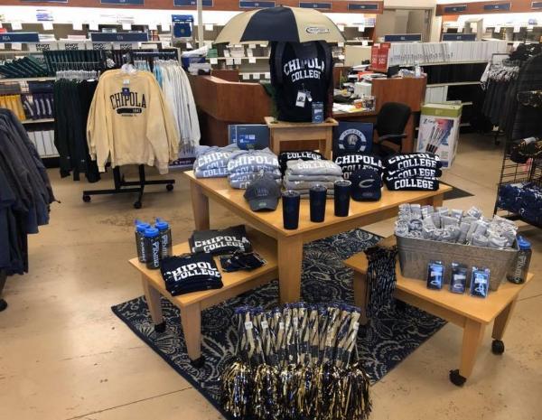 Various items for sale on a table in the college bookstore