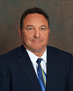 Board member smiling for headshot