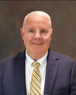 Board member smiling for headshot