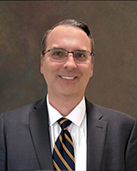 Board member smiling for headshot