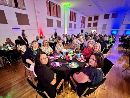 Staff enjoying the Back to School Glow Party Luncheon