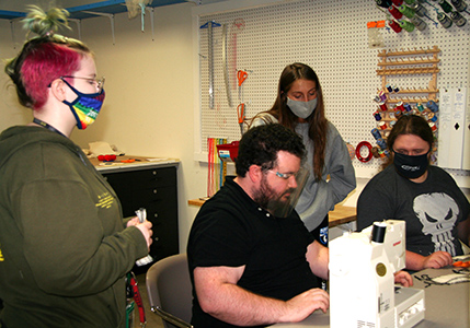 Costume Designer Kenan Burchette recently offered a workshop to Chipola College Technical Theatre students on costume creation. Here, Burchette shows Chipola students (L-R) Lucille Sloan, Burchette, Anzli Laurel and James Kidd how to properly thread a sewing machine. 