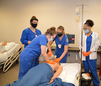 Chipola College’s final semester nursing students work with an adult patient simulator.