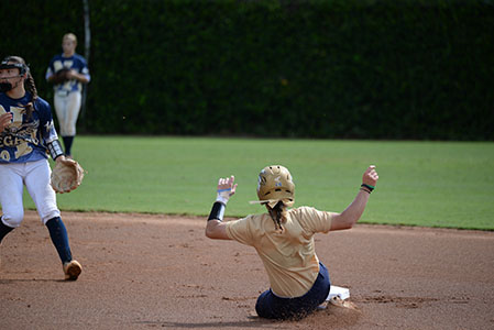 A Chipola softball player slides into second base.