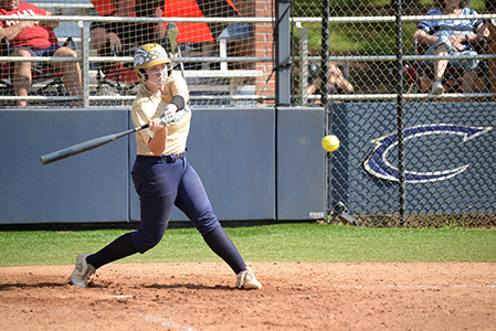 A Chipola softball player in mid-swing