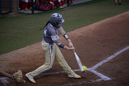 A Chipola softball player in mid-swing