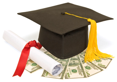 A graduation cap and rolled up certificate sit on fanned out money