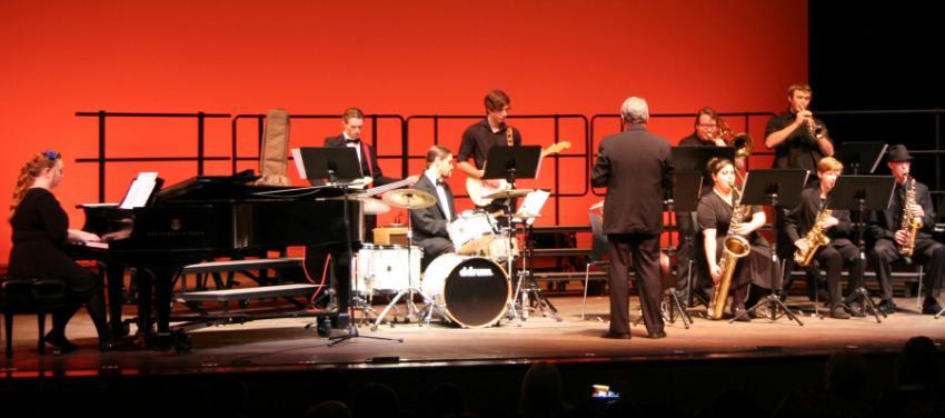 Members of the Chipola Rock & Jazz Band perform on stage.