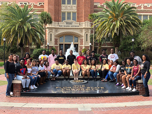 TRIO Students pose in front of fountain at FSU
