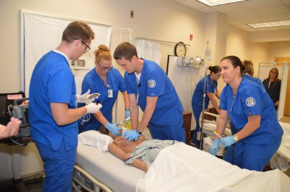 Chipola nursing students perform CPR on dummy.