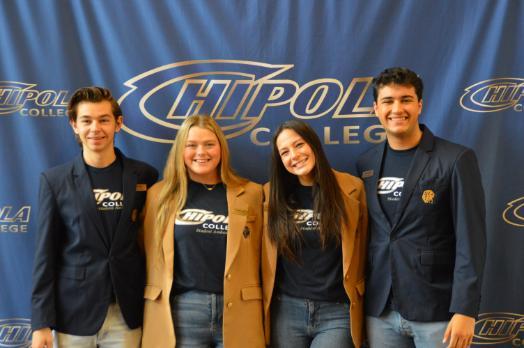 Photo of 4 ambassadors standing in front of Chipola Backdrop